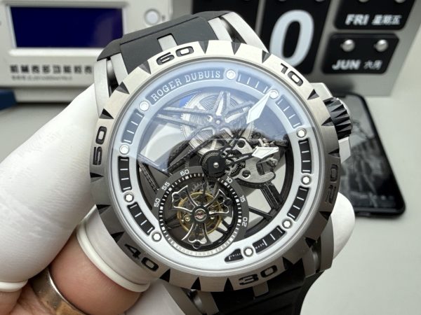 Elevate your collection with the Roger Dubuis Excalibur Spider RDDBEX0545, a bold statement of Swiss haute horlogerie and motorsport-inspired design. Designed for the modern connoisseur who craves both visual drama and mechanical mastery, this 45mm timepiece features a fully skeletonized dial, exposing every intricate detail of the in-house RD509SQ flying tourbillon movement. The iconic open framework, paired with a vibrant red-accented inner bezel and red DLC-coated crown, captures the adrenaline of the racetrack, while the lightweight grade 5 titanium case ensures comfort without compromising durability. Protected by an anti-reflective sapphire crystal, the watch offers crystal-clear visibility of the movement’s hand-finished bridges, gears, and the mesmerizing flying tourbillon at 6 o’clock. The integrated black rubber strap with a secure folding clasp provides a sporty, ergonomic fit, ideal for both formal occasions and active lifestyles.
